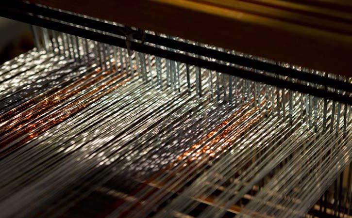 Close up of textiles in weaving machine